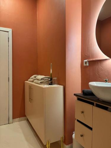 a bathroom with a sink and a white cabinet at Your Haven of Peace! in Brussels