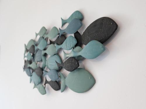 a bunch of green and black rocks on a white background at Modern Apartment by the Sea in Porspoder