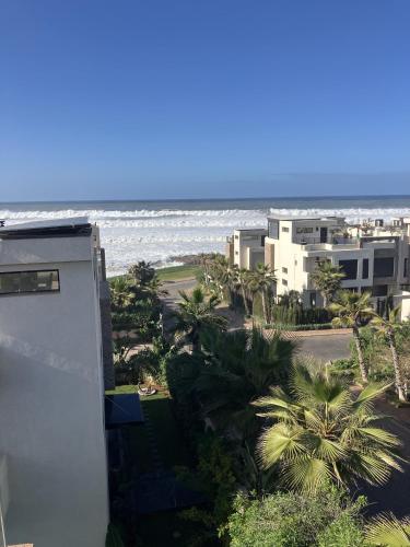 a view of the ocean from a building at Seafront Luxury Villa with Amazing pool! in Dar Bouazza