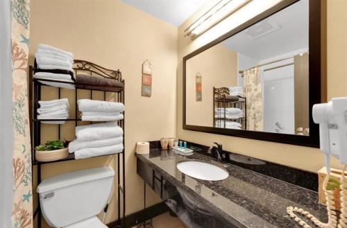 a bathroom with a sink and a large mirror at Little Harbor Resort #301 Tampa Bay FL Beach, Nautical Paradise in Ruskin