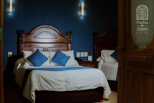 Ένα ή περισσότερα κρεβάτια σε δωμάτιο στο Hotel Puebla de Antaño
