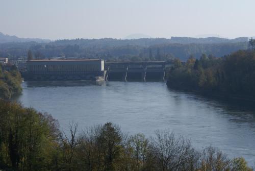 a train on a bridge over a river at Hotel Storchen in Rheinfelden