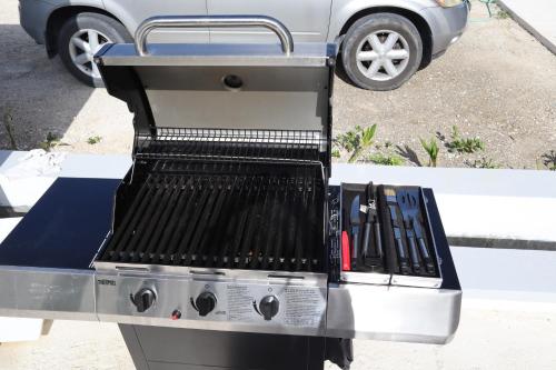 a grill sitting on top of a table at Ocean Pearl - Getaway Modern Villa W Pool in Long Bay Hills