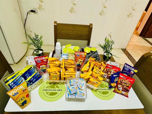 a table with a bunch of food and snacks on it at L'Aquolina in Socorro