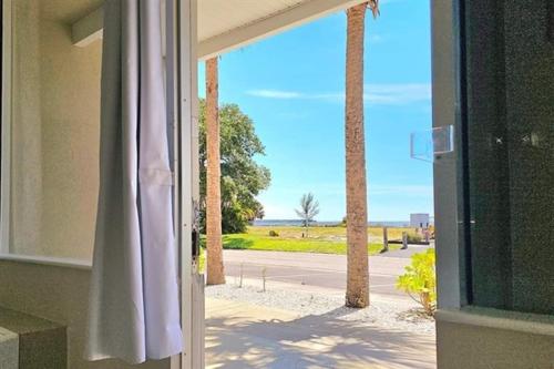 an open window with a view of a street with palm trees at Little Harbor Resort #308 Tampa Bay FL Beach, Bayview, Pools in Ruskin