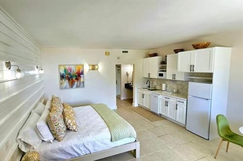 a large bedroom with a bed and a kitchen at Little Harbor Resort #308 Tampa Bay FL Beach, Bayview, Pools in Ruskin