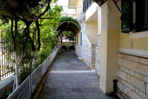 an alley way in a building with an archway at Asterias in Koronisía