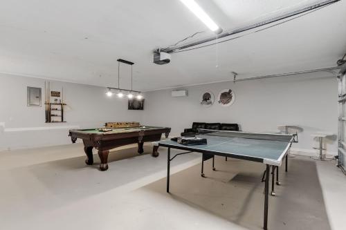 a room with a ping pong table in it at Spacious and private home at Boiling Springs in Boiling Springs