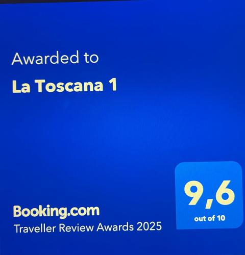 a screenshot of a cell phone with the text awarded to la toscana at La Toscana 1 in Piriápolis