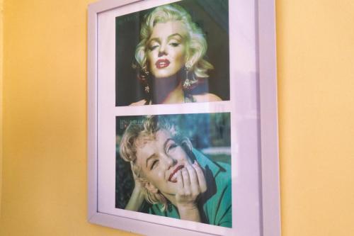 a picture of a woman in a picture frame on a wall at Hostal Boonen in Santiago