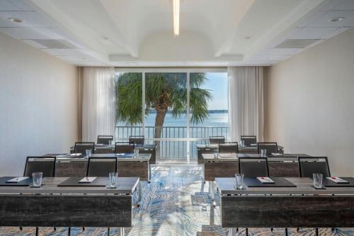 a room with tables and chairs and a large window at Clearwater Beach Marriott Resort on Sand Key in Clearwater Beach