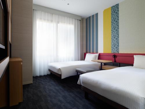 Katil atau katil-katil dalam bilik di Mitsui Garden Hotel Kyoto Shijo
