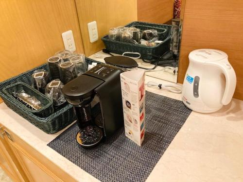 a coffee maker on a counter in a kitchen at ホテルウォーターゲート岡山 in Okayama