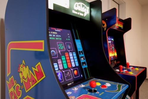 an arcade video game machine with a game at Mineral Soak Rockers Fire Pit Game Room Fun in Meridian