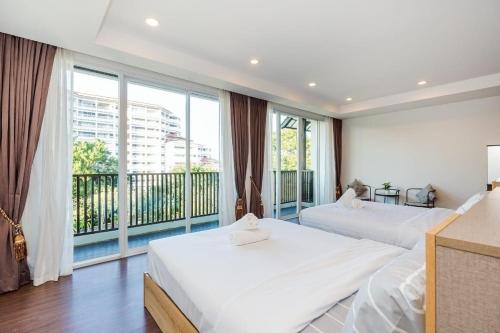 Ένα ή περισσότερα κρεβάτια σε δωμάτιο στο Villa Nirvana, Hua Hin