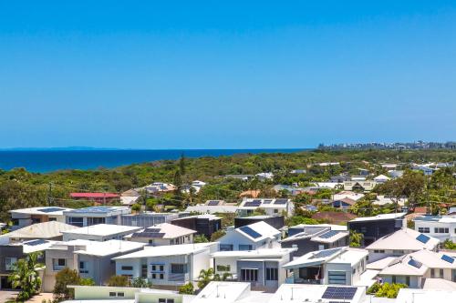 an aerial view of houses in a suburb at Azzure Bokarina Penthouse- Brand New- Ocean View- Resort Style Pool- Steam Room in Bokarina