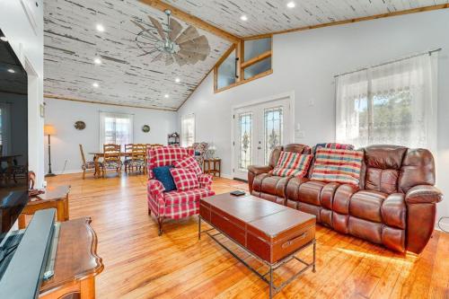 a living room with a couch and chairs and a table at Walk to Downtown Shops and BBQ Home with Fenced Yard in Lockhart