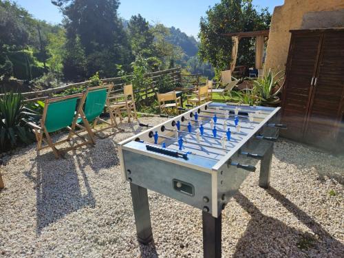 a game of chess on a table in a yard at Rustico immerso nella natura a due passi dal mare in Strettoia