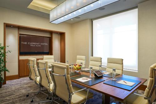 a conference room with a long table and chairs at The Clement Hotel in Palo Alto