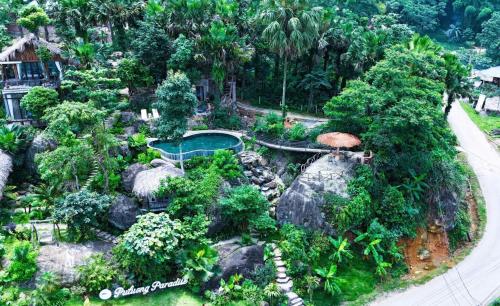 an aerial view of a garden with a pool and rocks at Pu Luong Paradise in Hương Bá Thước