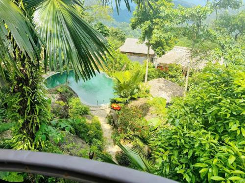 a view of a resort with a body of water at Pu Luong Paradise in Hương Bá Thước