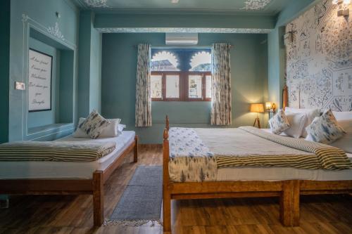 Ένα ή περισσότερα κρεβάτια σε δωμάτιο στο Footprint Hostel Udaipur