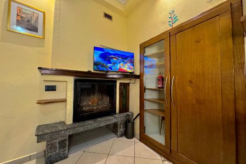 Borgo di Porlezza - Happy Rentalsにあるテレビまたはエンターテインメントセンター