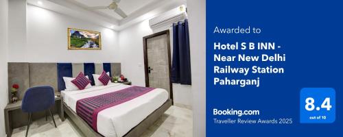a bedroom with a bed and a desk with a bed sidx sidx sidx at Hotel SB Grand Inn - Paharganj in New Delhi