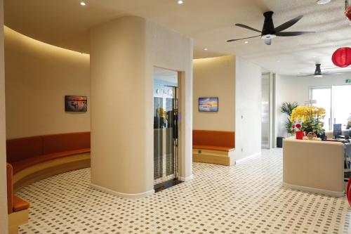 a lobby of a store with a ceiling fan at Lá Riverside Boutique Hotel in Mỹ Phước