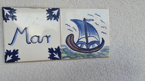 a sign for a may hanging on a wall at Mi Casa Mar in Mosonmagyaróvár