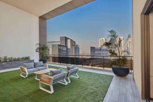 a balcony with a view of a city skyline at Hilton Gurugram Baani City Centre in Gurgaon