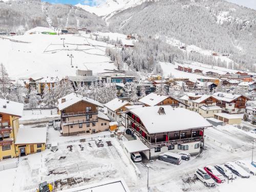 an aerial view of a town covered in snow at Hotel Garni Maria Theresia in Sölden