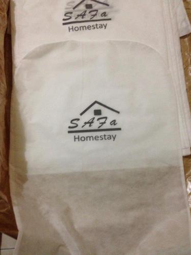 a white bag with the logo of a house on it at Safa Homestay in Yogyakarta