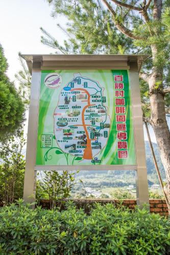 a sign for a park with a map at Bai Shengcun Homestay in Guoxing