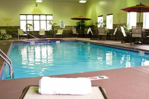 a large swimming pool in a hotel room at Holiday Inn Express Hotel & Suites Vineland Millville by IHG in Vineland