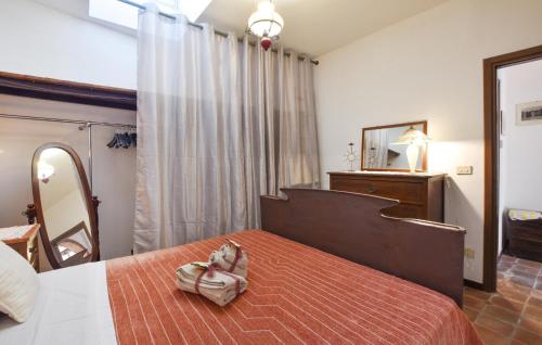 a bedroom with a bed with a purse on it at 1 Bedroom Gorgeous Home In Mascalucia in Mascalucia