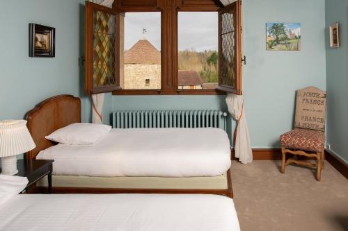 Postel nebo postele na pokoji v ubytování DOMAINE ST GERMER