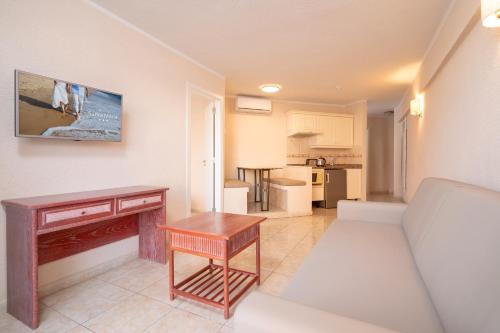 a living room with a couch and a table at HOVIMA Santa María in Adeje