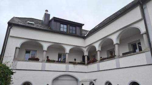 a white building with arches and windows on it at Unterkunft im Mühlviertel in Schenkenfelden
