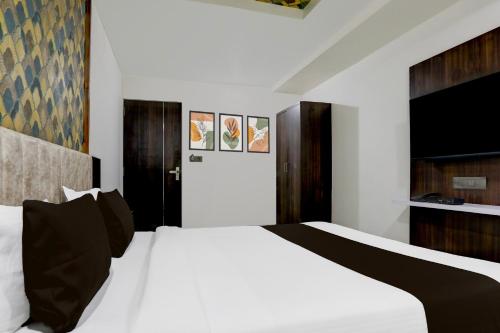Super Hotel O Nana Chiloda Near Airport Formerly Green Valleyにあるベッド