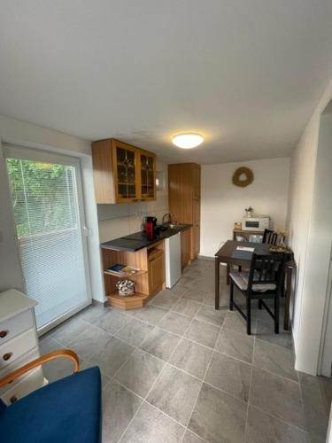 a kitchen with a table and a dining room at Astoria Lednice in Lednice