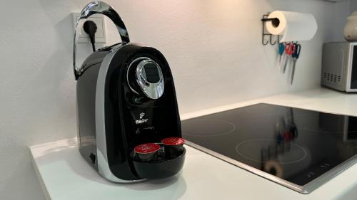 a toaster sitting on top of a kitchen counter at African Paradise with Jacuzzi & Sauna in Vienna