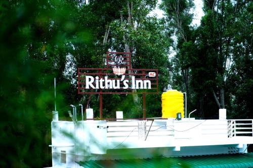 a sign for a raffles inn on a boat at Rithu's Inn in Yelagiri