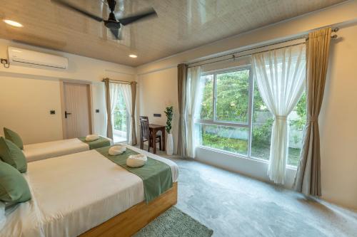 Postel nebo postele na pokoji v ubytování Blissview Maldives - Thulusdhoo