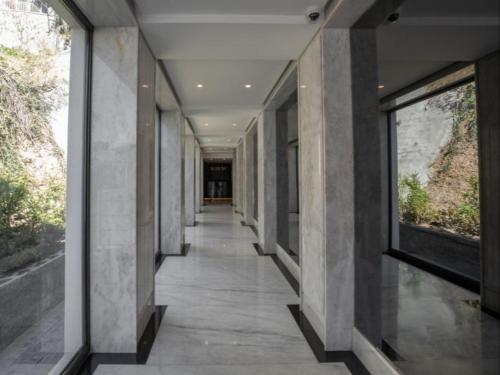 a hallway of a building with large windows at Aurum 501 and 101 in Cape Town