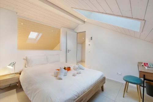 Postel nebo postele na pokoji v ubytování Corte di Ascona Apartments - Happy Rentals