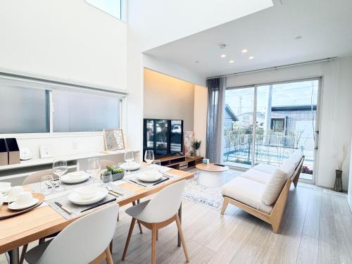 a kitchen and dining room with a table and chairs at Akikawa Miyoshi 6 in Fukumoto