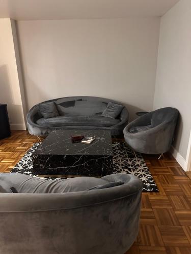 a living room with a couch and a table at Warm and Welcoming in Los Angeles