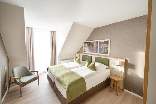 Postel nebo postele na pokoji v ubytování BEECH Resort Plauer See