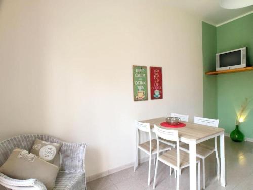 a dining room with a table and a table and chairs at Casa Iris con splendida vista mare in Torre Vado